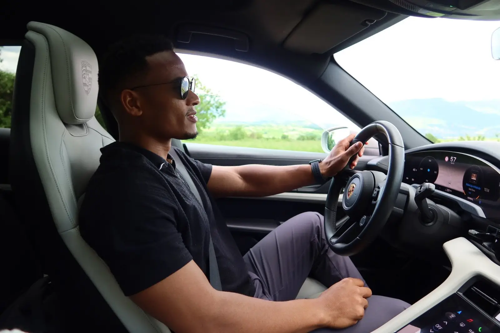 Driving through the Dolomites, hands on the wheel