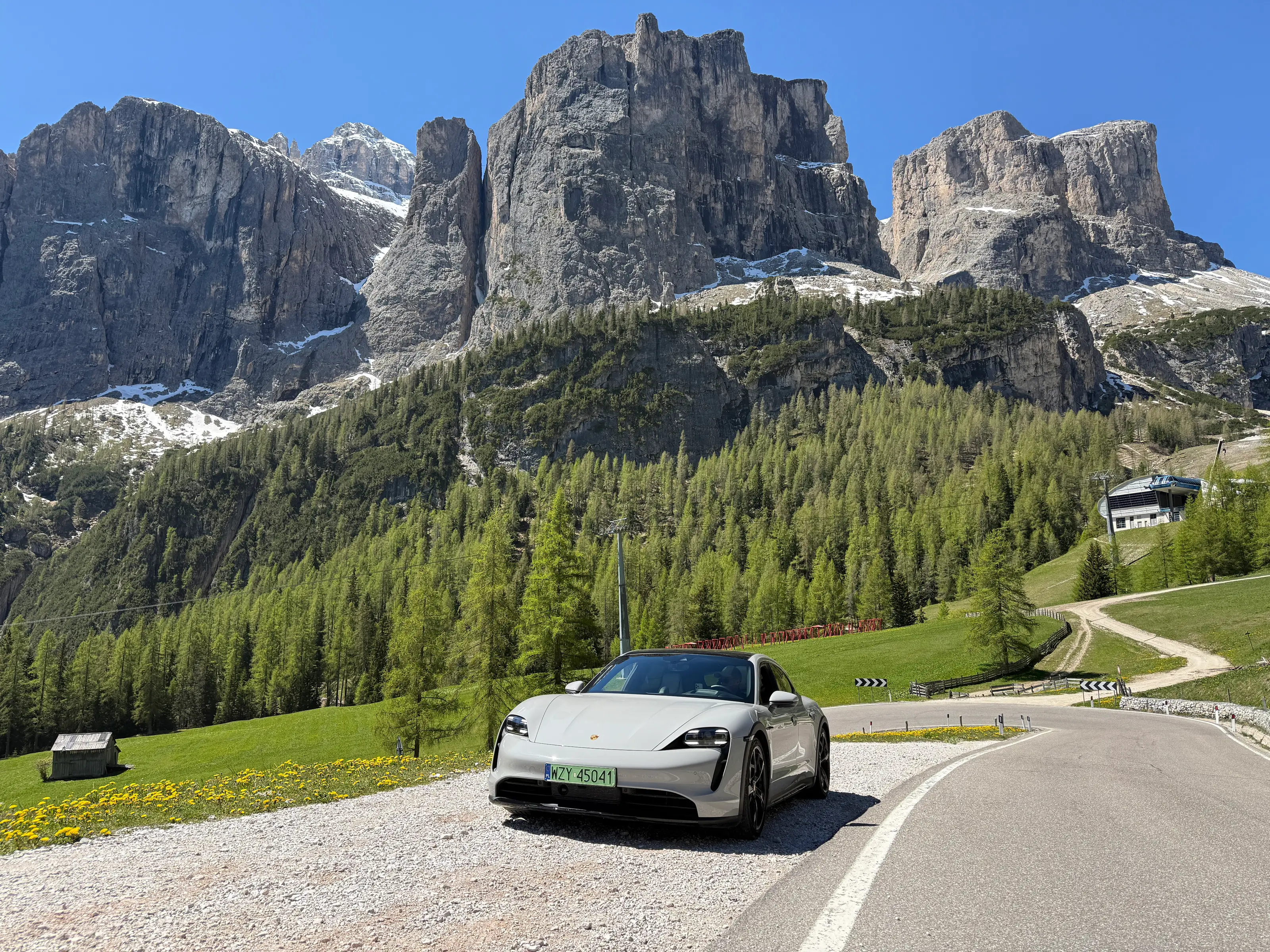 Porsche on a mountain pass road through the Dolomites