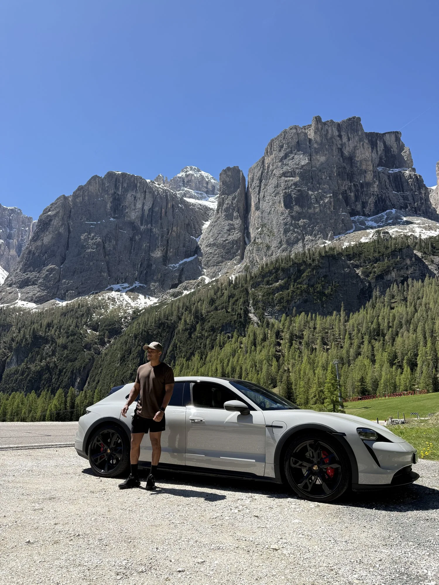 Seren Mont founder Tarik Bob with Porsche Taycan Cross Turismo below the Sella massif