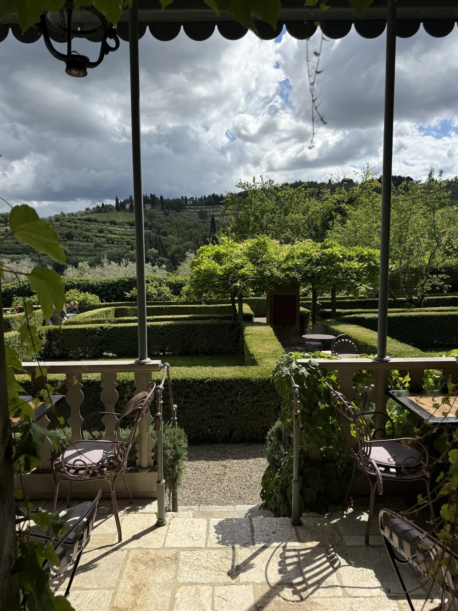 Morning on the villa garden terrace, Tuscan hills beyond, before departure