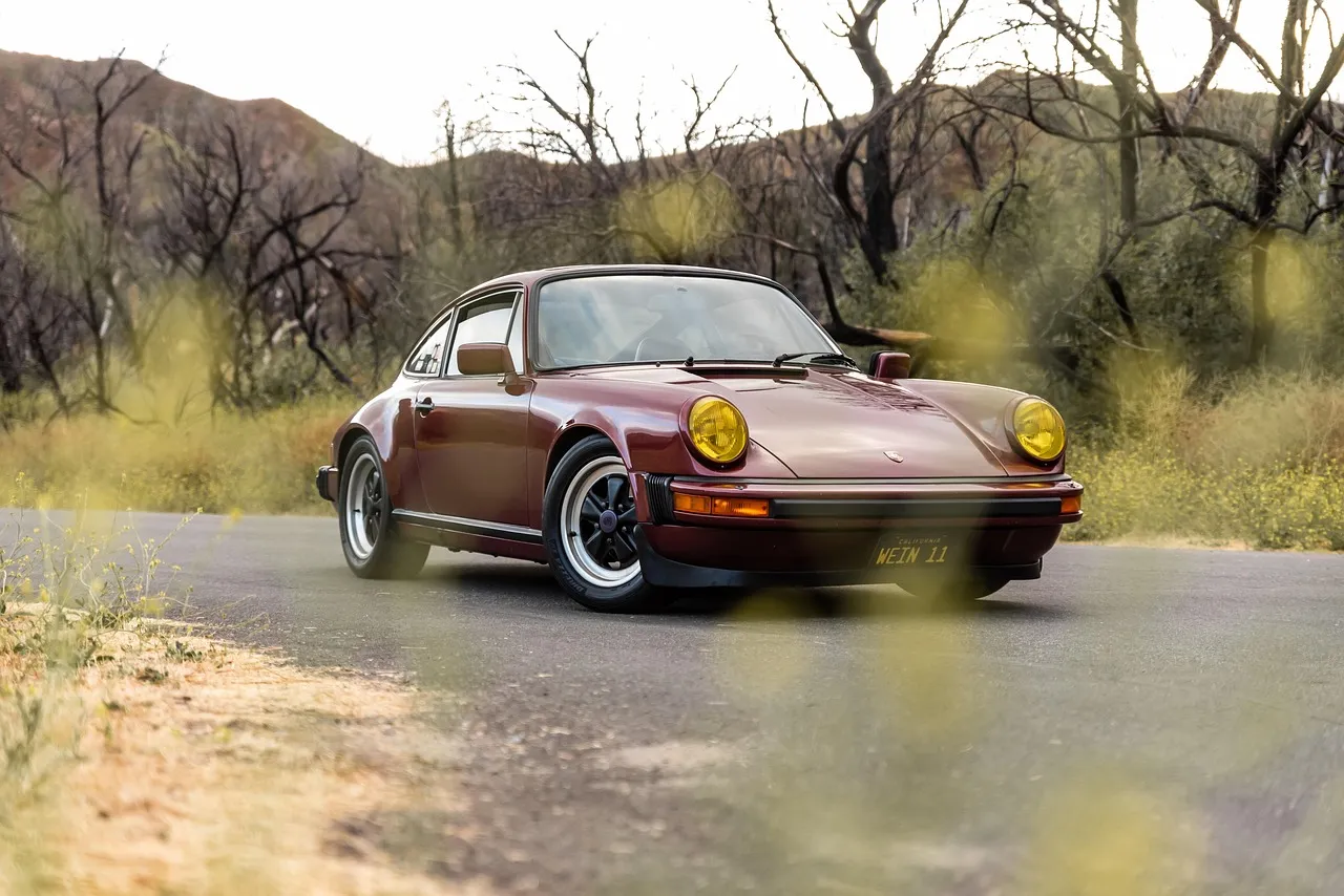 Sports car driving through Tuscany